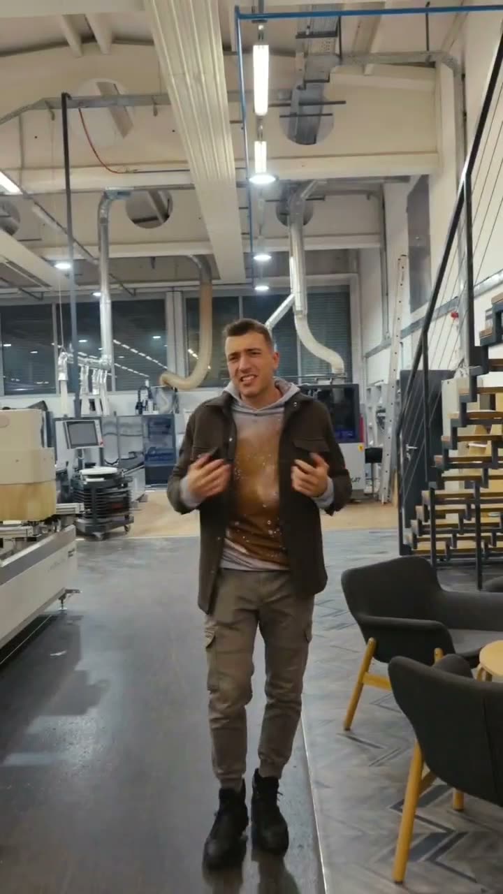 The finished, graded cut of the founder's own talking take in his workshop: composed and confident, talking straight through a continuous walk across the workshop.